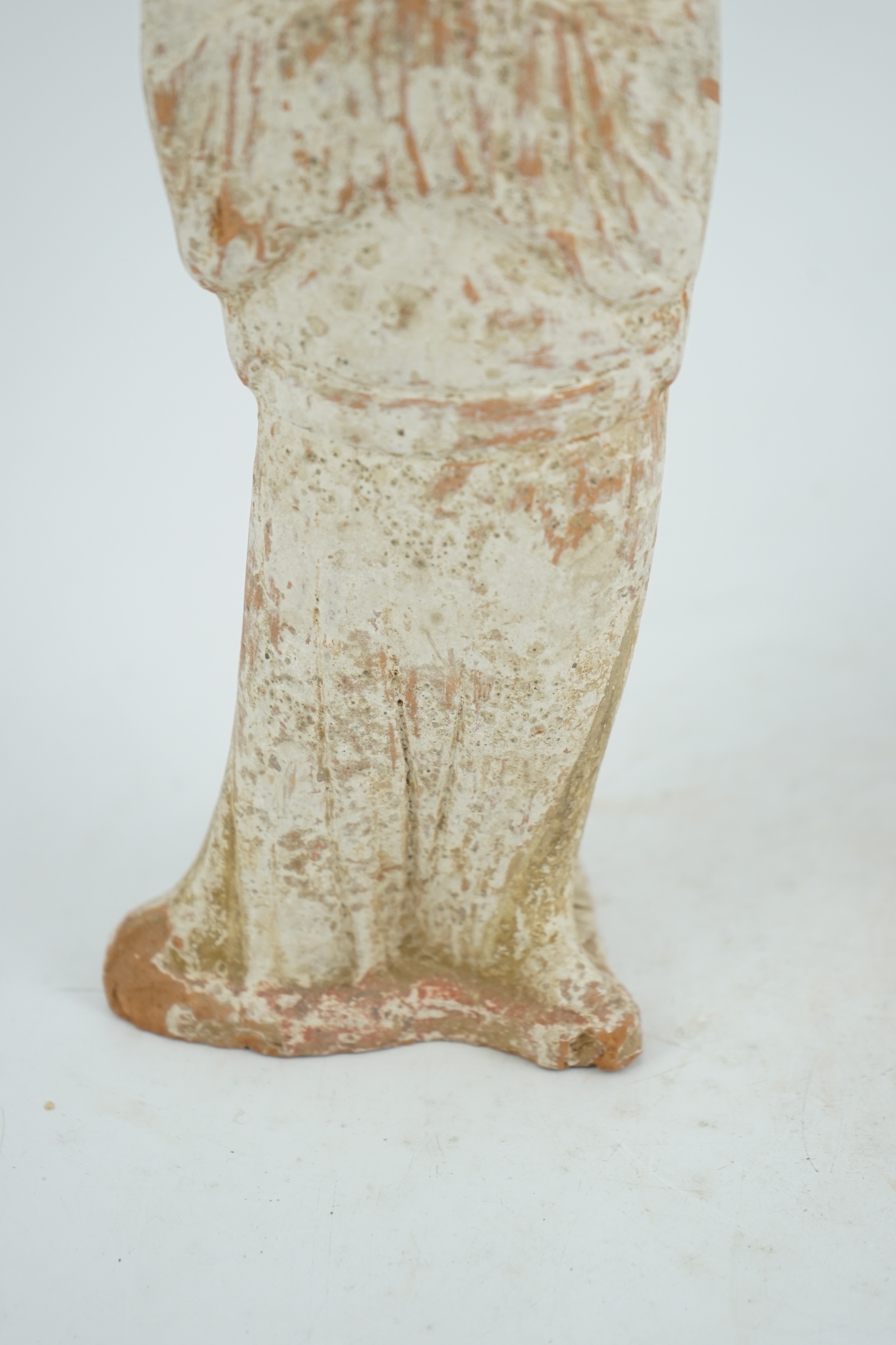 A Chinese painted pottery groom figure, Tang Dynasty (AD 618-906)